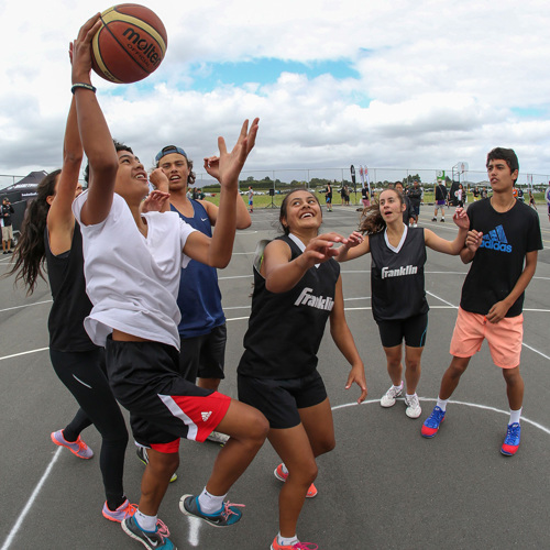 Rangatahi playing basketball